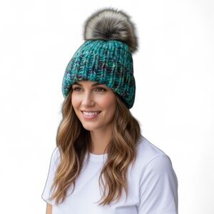 Hand knit blues/greys/greens variegated knit hat with faux fur pom
